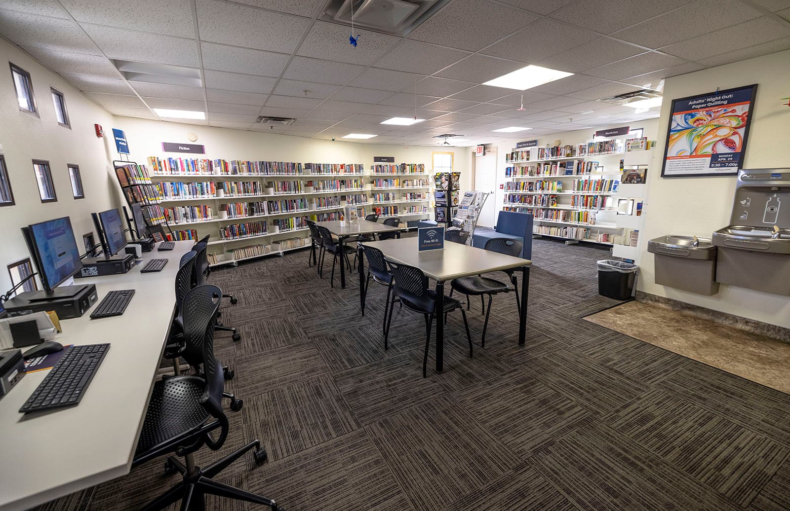 Photo of the adult computers, tables and bookshelves