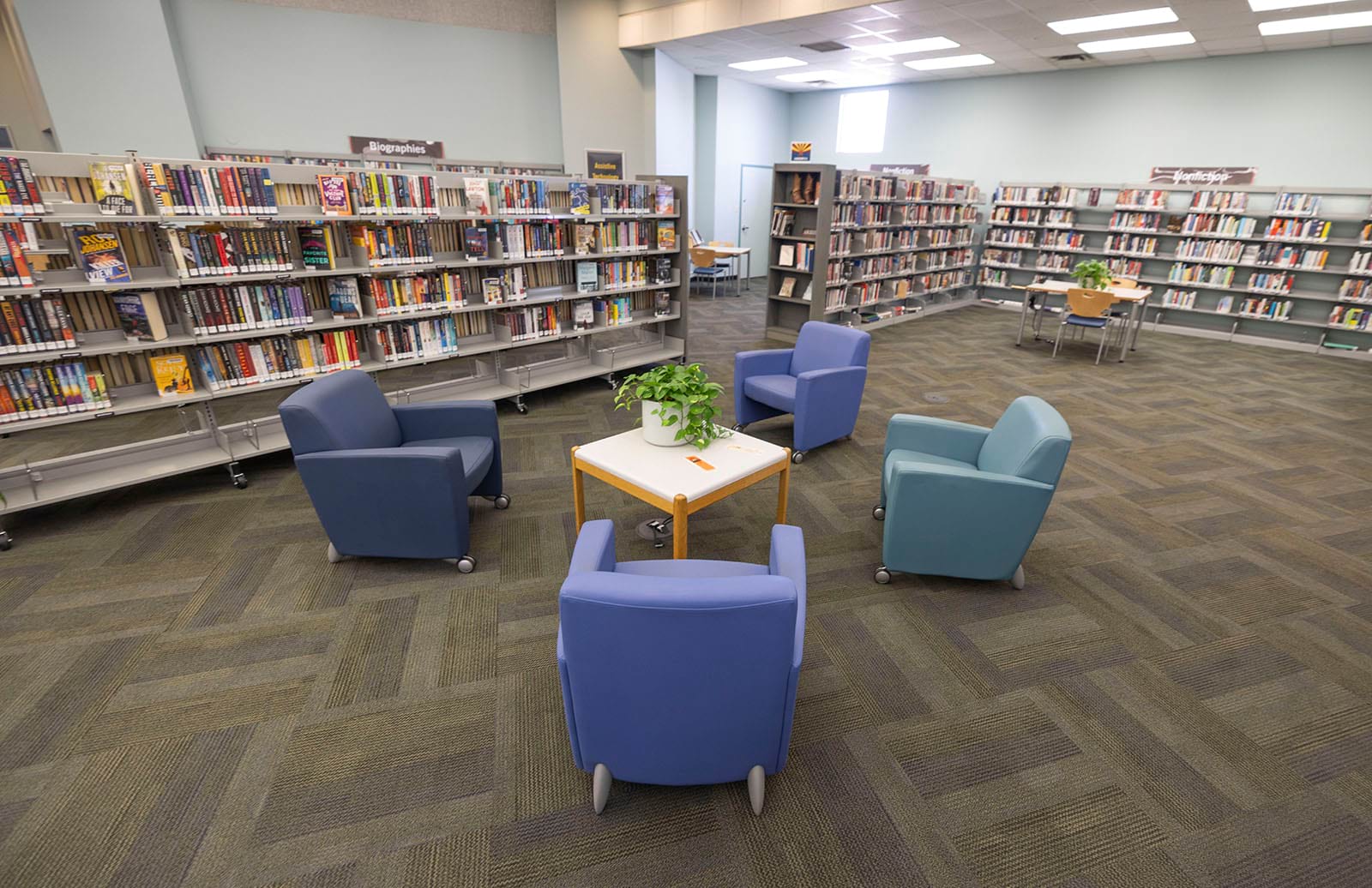 Photo of the Nonfiction shelves and seating at the Sun City Library